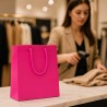 Luxury shopping bag in fuchsia plastic-coated paper with drawstring