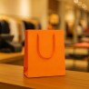 Shopper di lusso in carta plastificata arancio con cordoncino